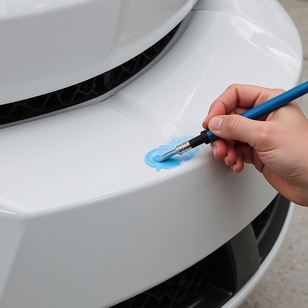 Applying touch-up paint to a car bumper