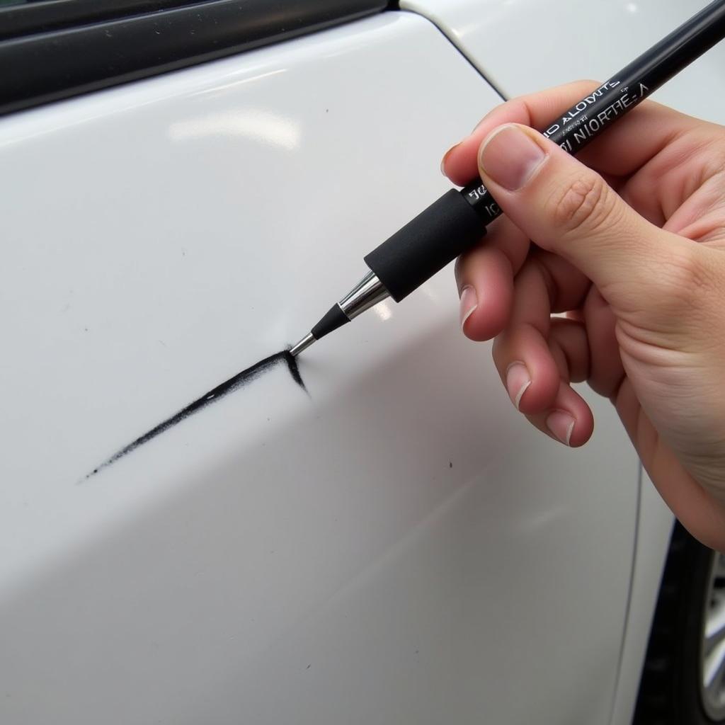 Applying Touch-Up Paint to Car Scratch