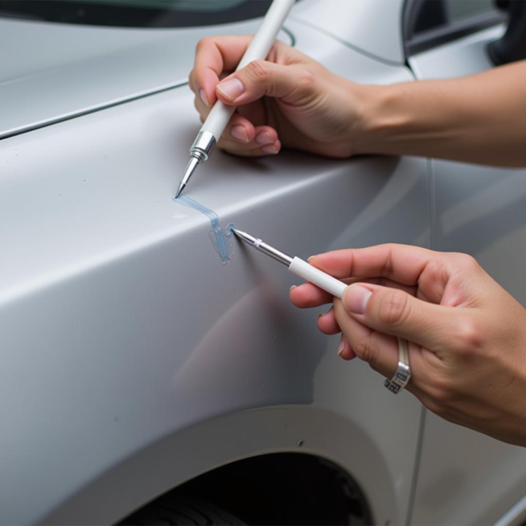 Applying Touch-Up Paint to Car Scratch