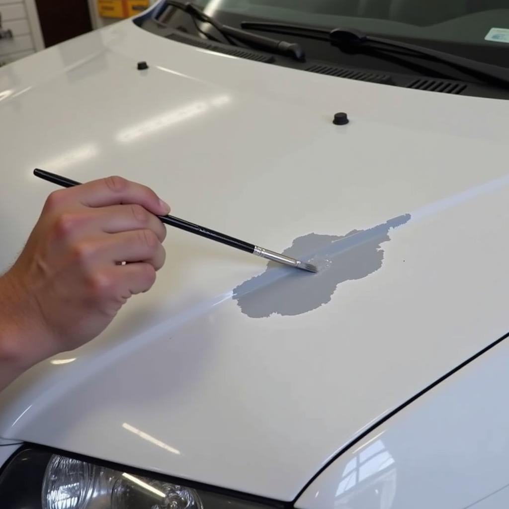 Applying touch-up paint to a large car chip