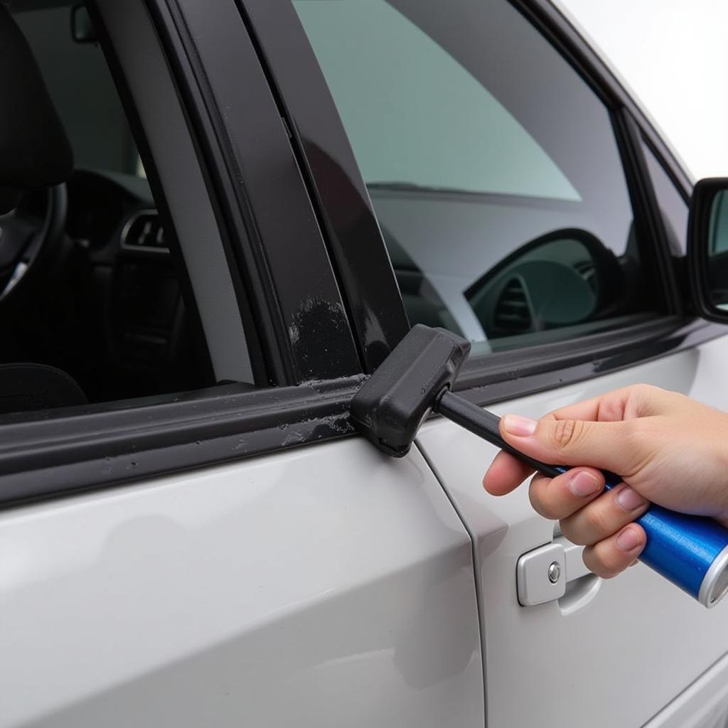 Applying trim restorer to car window