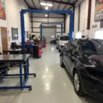 Inside a professional car body repair shop in Aylesbury.