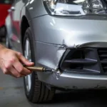 Assessing the damage on a bent car bumper