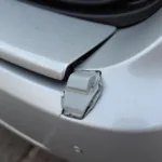 Broken Car Bumper Clip Showing Damage