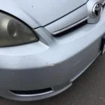 Damaged bumper needing paint repair