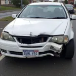 Car with significant body damage in Runcorn needing repair at a reputable shop