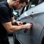 Dent removal process on a car body in Bexhill