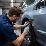 Car body repair process in Brixworth showcasing dent removal