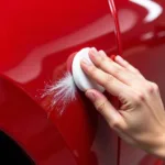 Applying Car Body Repair Compound to a Scratched Car Panel