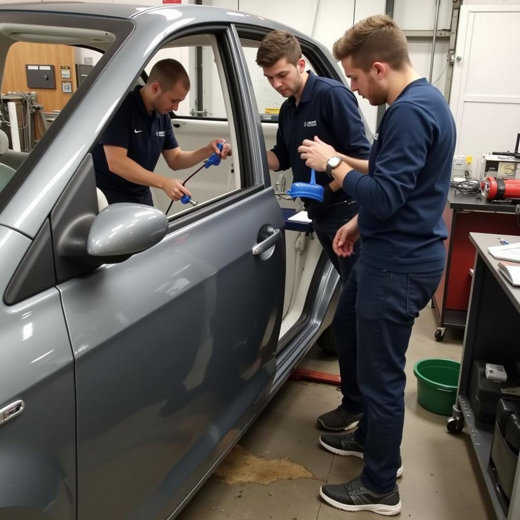 Car Body Repair Course in Nottingham: Students Working on a Vehicle