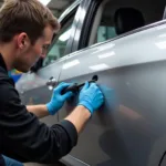 Dent removal on a car in Falmouth