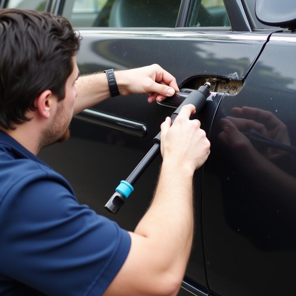 Car body repair in Mitcham showing dent removal process