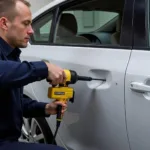 Car body repair in Penrith showing dent removal process