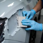 Applying Car Body Repair Resin