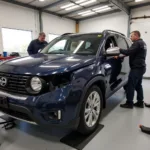 Car body repair shop in Wickhamford with skilled technicians working on a vehicle