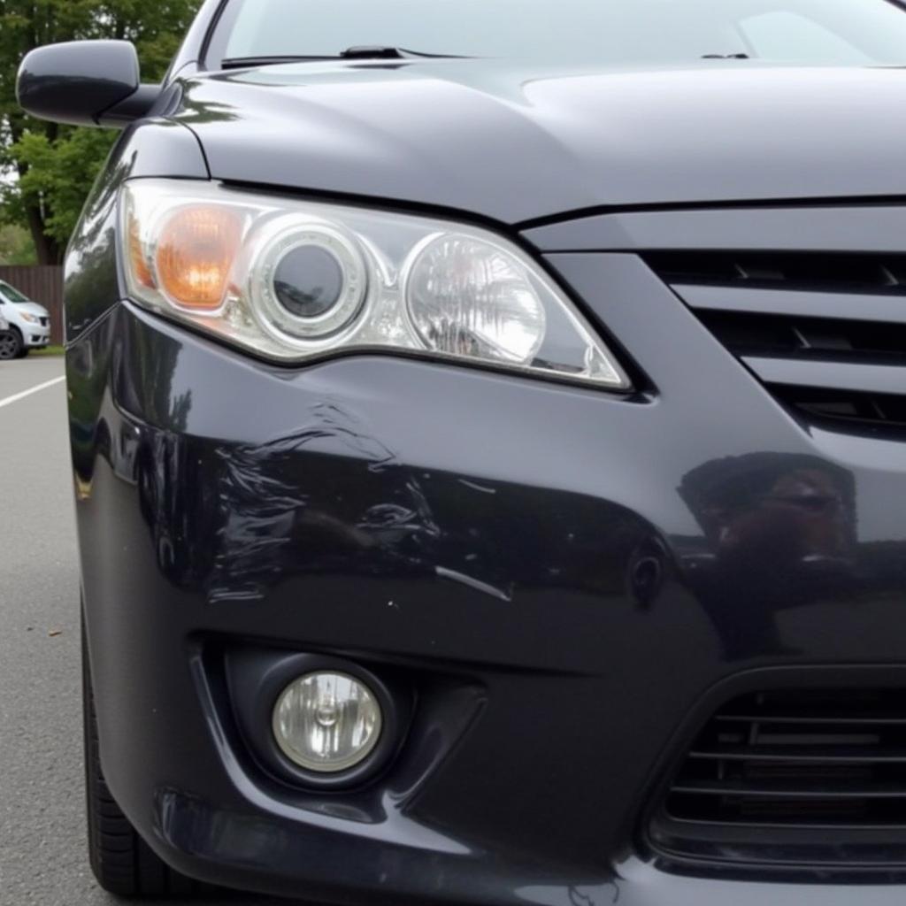 Car with damaged body panels in Wallasey needing repair