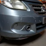 Damaged bumper requiring car body repair in Worcester