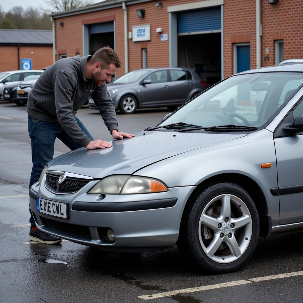 Final inspection of a repaired car in Darley Dale