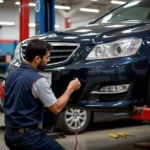 Car bumper repair at a garage in India