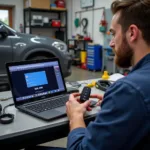 Car Key Repair Technician in Swindon - A skilled technician is programming a new car key using specialized diagnostic equipment.