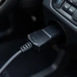 Car OBD2 Port Connected to Diagnostic Cable