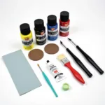 Car paint chip repair kit essentials: Primer, paint, clear coat, and applicator tools.