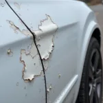 Close-up view of car paint flaking