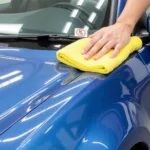 Waxing car for paint protection against bubbling