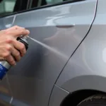 Applying Car Paint Repair Aerosol