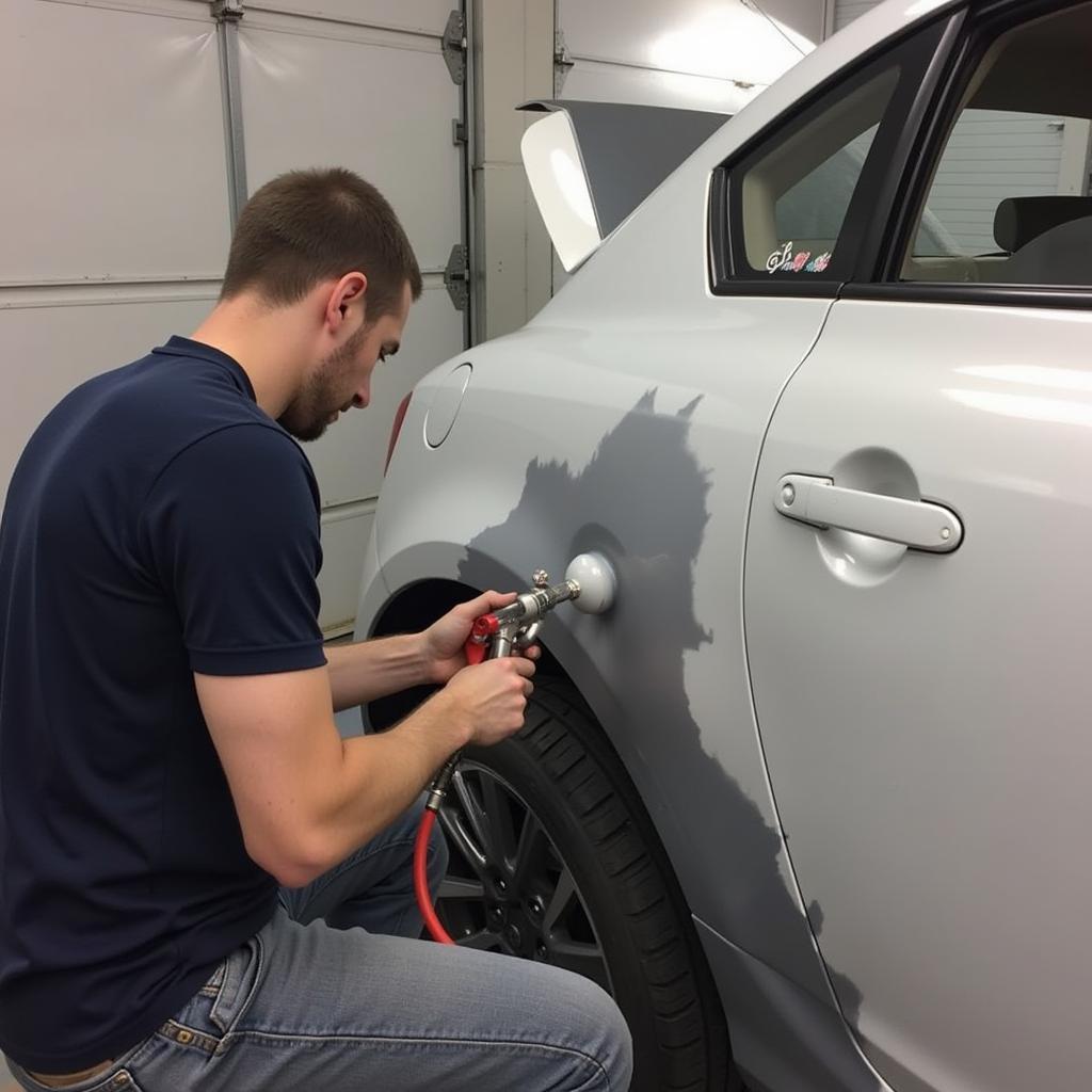 Car Paint Repair Shropshire: Specialist Applying Paint