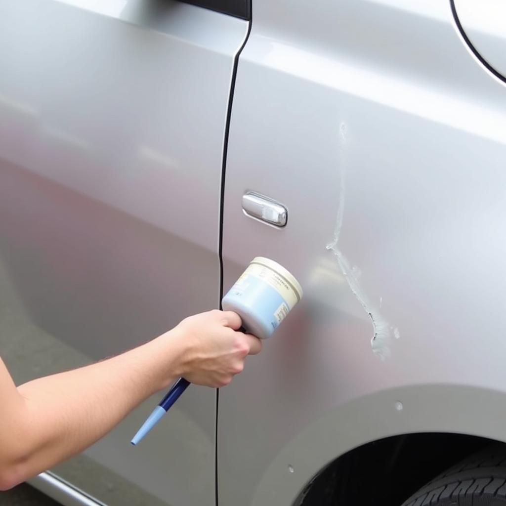 Applying Touch-Up Paint to Repair a Car Scratch