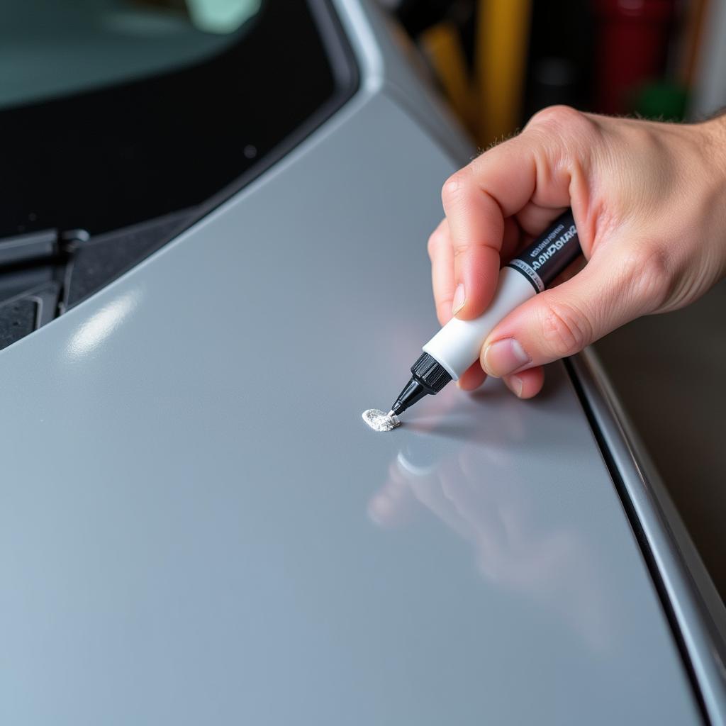 Applying Touch-up Paint to a Stone Chip on Car Hood