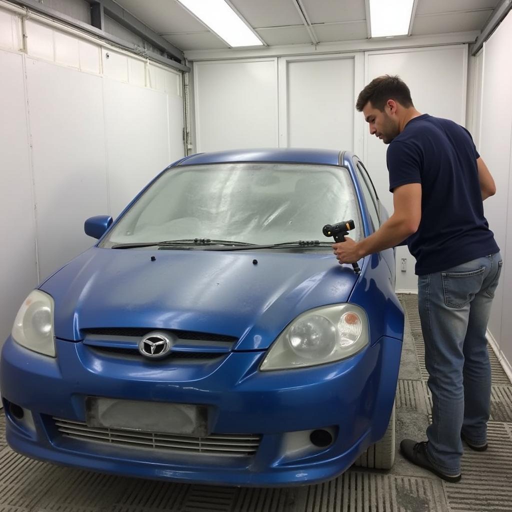 Car spray painting at a body repair shop in Mitcham