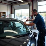 A car having its window replaced at a shop in Smyrna