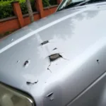 Close up of chipped car paint damage on a vehicle in the UK