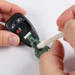 Cleaning Car Key Fob Contacts with Rubbing Alcohol