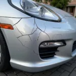 Close-up view of cracked paint on a car bumper