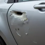 Cost of repairing a dent in a car door