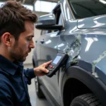 Experienced Car Body Repair Technician Inspecting Vehicle in Norwich