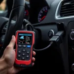 Handheld diagnostic tool connected to a car's OBD-II port