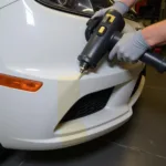 Using a heat gun to reshape a plastic bumper