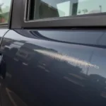 Keyed car with a superficial scratch