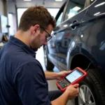 Mechanic Performing a Car Diagnostic in Cape Town