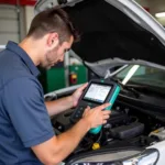 Mechanic Diagnosing Car Problem with OBDII Tool