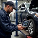 Mechanic Performing a Car Diagnostic with a Professional Tool