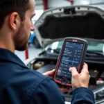 Mechanic Using Diagnostic Tool in Garage