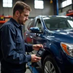 Mechanic using a car diagnostic tool on a car in a workshop.