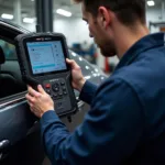 Mechanic Using Wovv Diagnostic Tool on a Vehicle