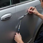 Minor Scratch Repair Bolton: A close-up of a car with a minor scratch being repaired by a technician.