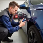 Mobile Car Paint Dent Repair Technician Working On-Site in Corona